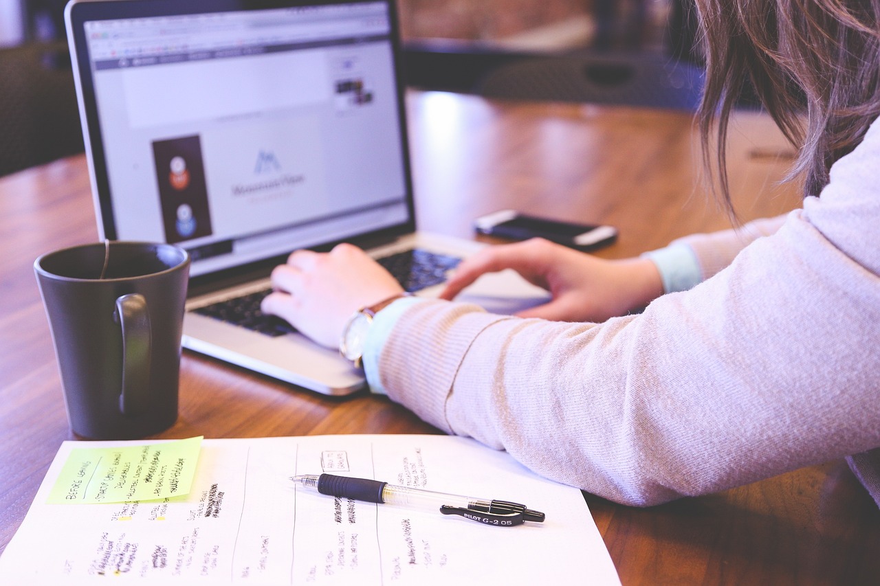 woman typing on laptop